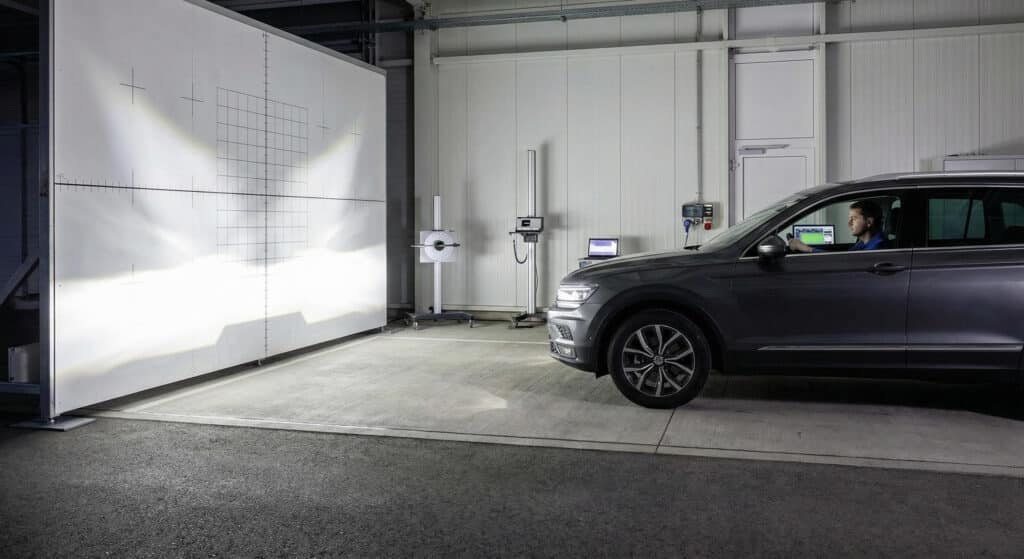 LED headlight beam pattern test showing low beam cut-off line and high beam illumination effect