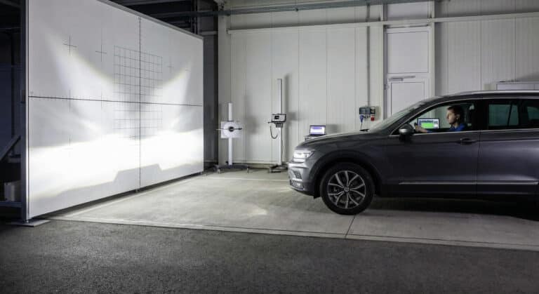 LED headlight beam pattern test showing low beam cut-off line and high beam illumination effect